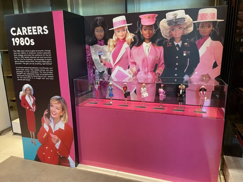 Display case depcting Barbie Careers in the 80s. 