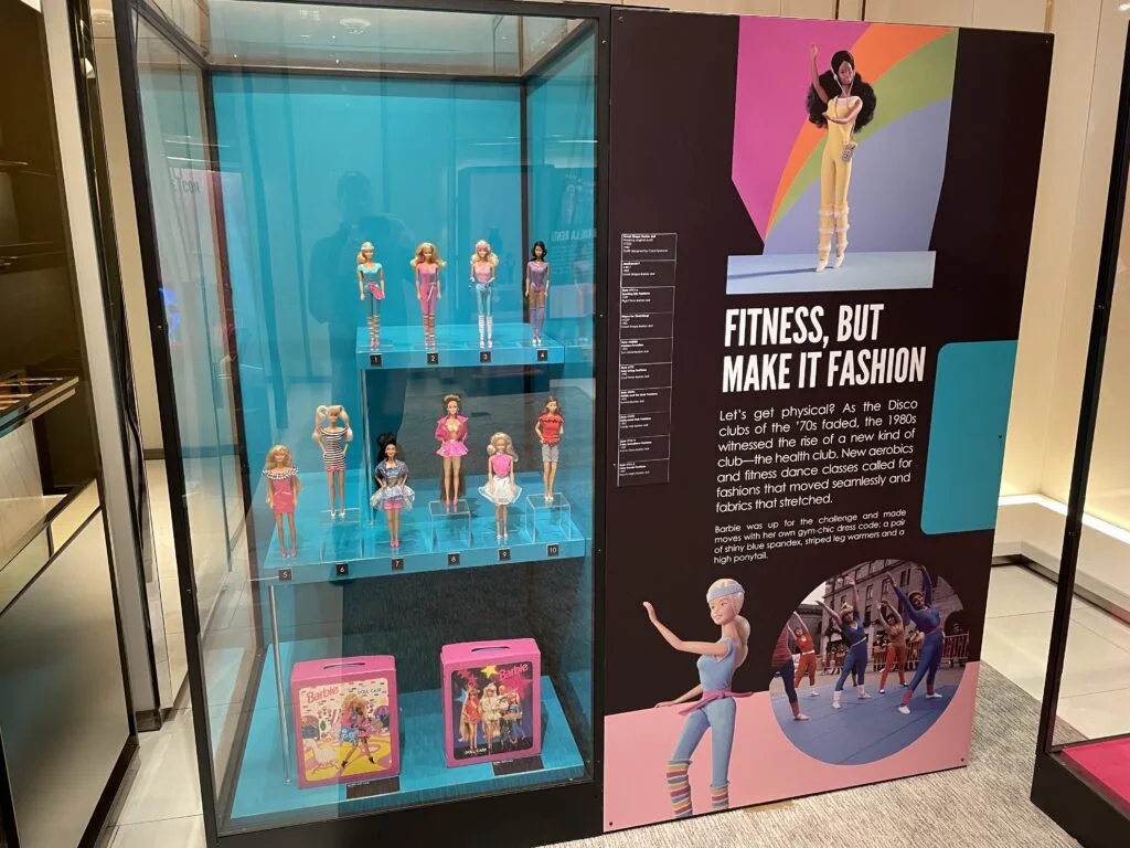 Display case of Barbies wearing fitness apparel.