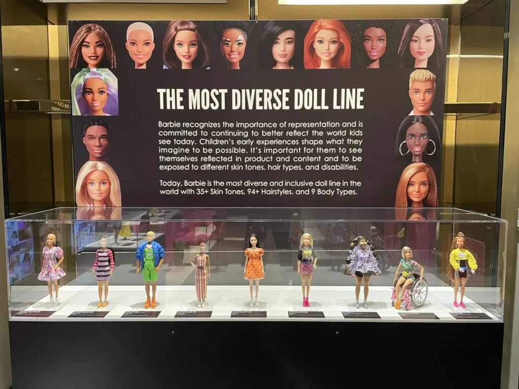 A case of several modern dolls highlighting the brand's diversity. 