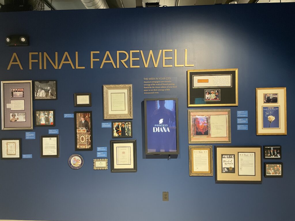 A wall at the exhibit titled "A Final Farewell" lined with information and artifacts. 