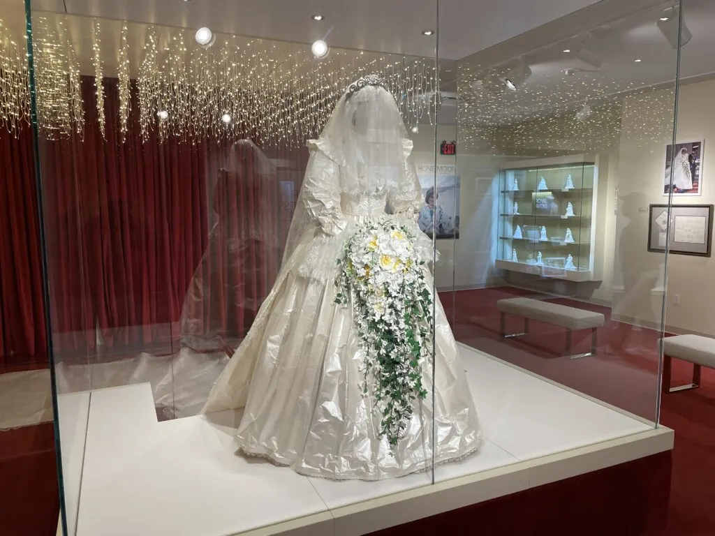 A replica production of Princess Diana's wedding dress in a glass case. 