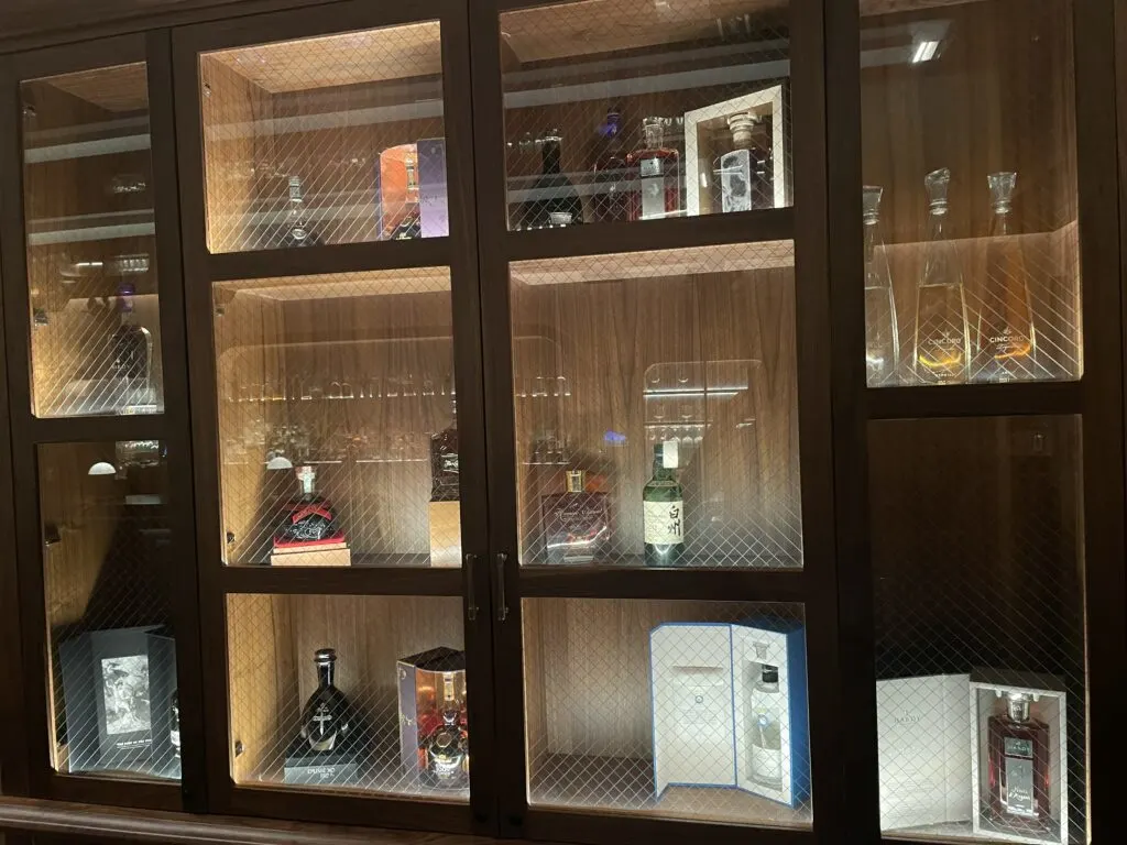 A decorative display case at The Count Room stocked with booze bottles. 