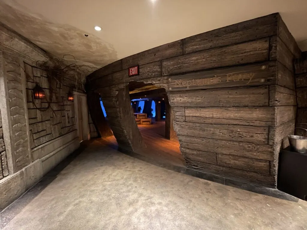 Entryway to the ship exhibit that gives the illusion that you're entering through a hole in the hull. 