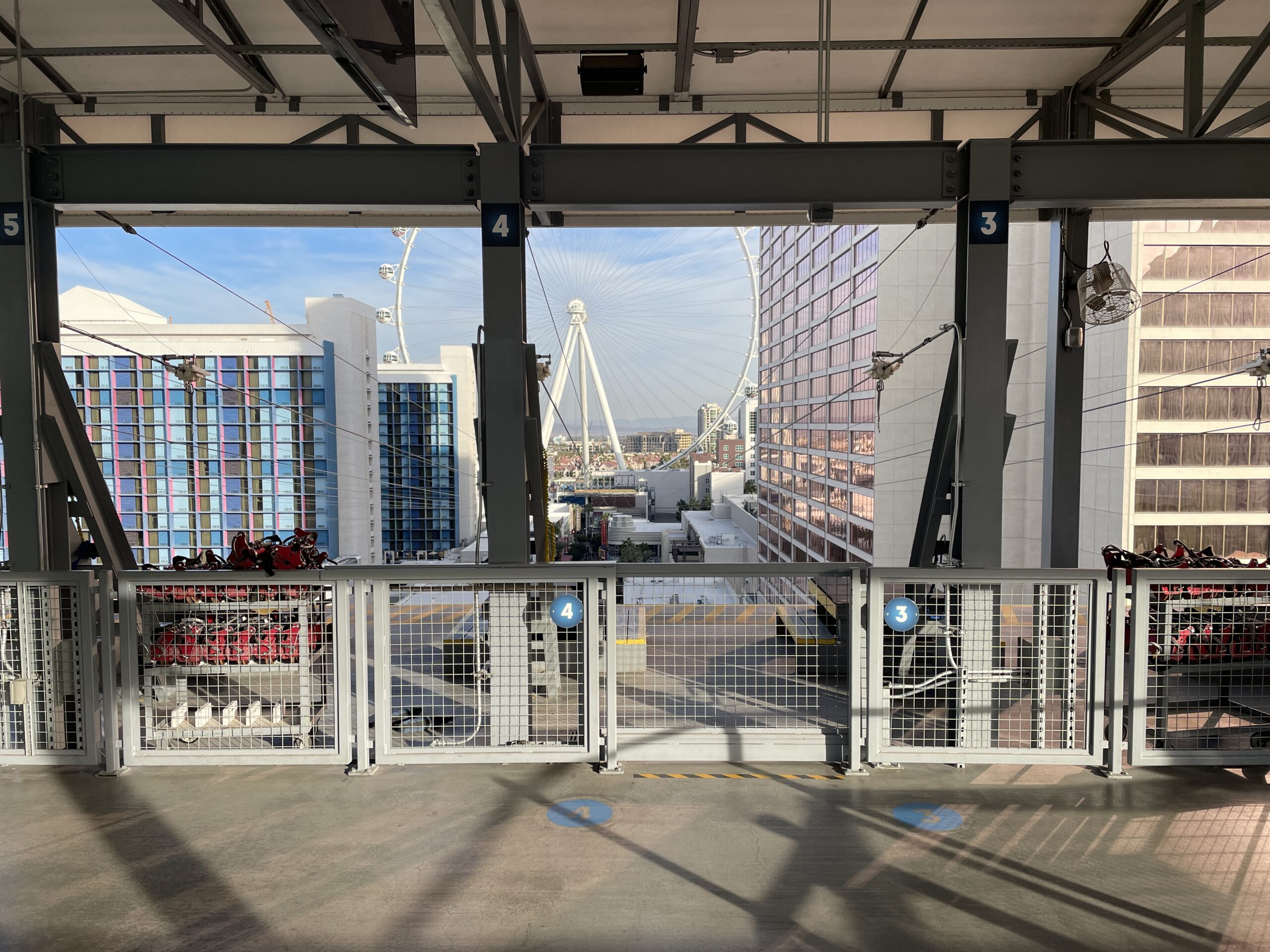 View from the launch deck at FlyLINQ. Linq is on the left and Flamingo is on the right. The high roller observation wheel is in the background.