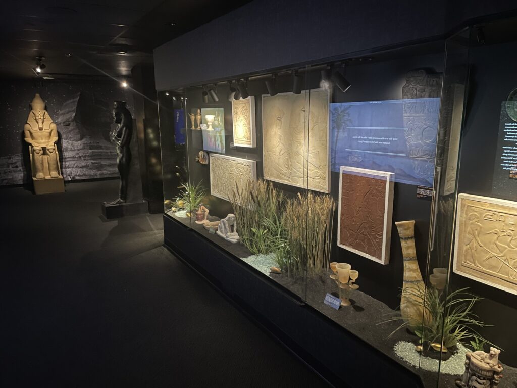 Items of cultural significance are housed behind a glass wall.