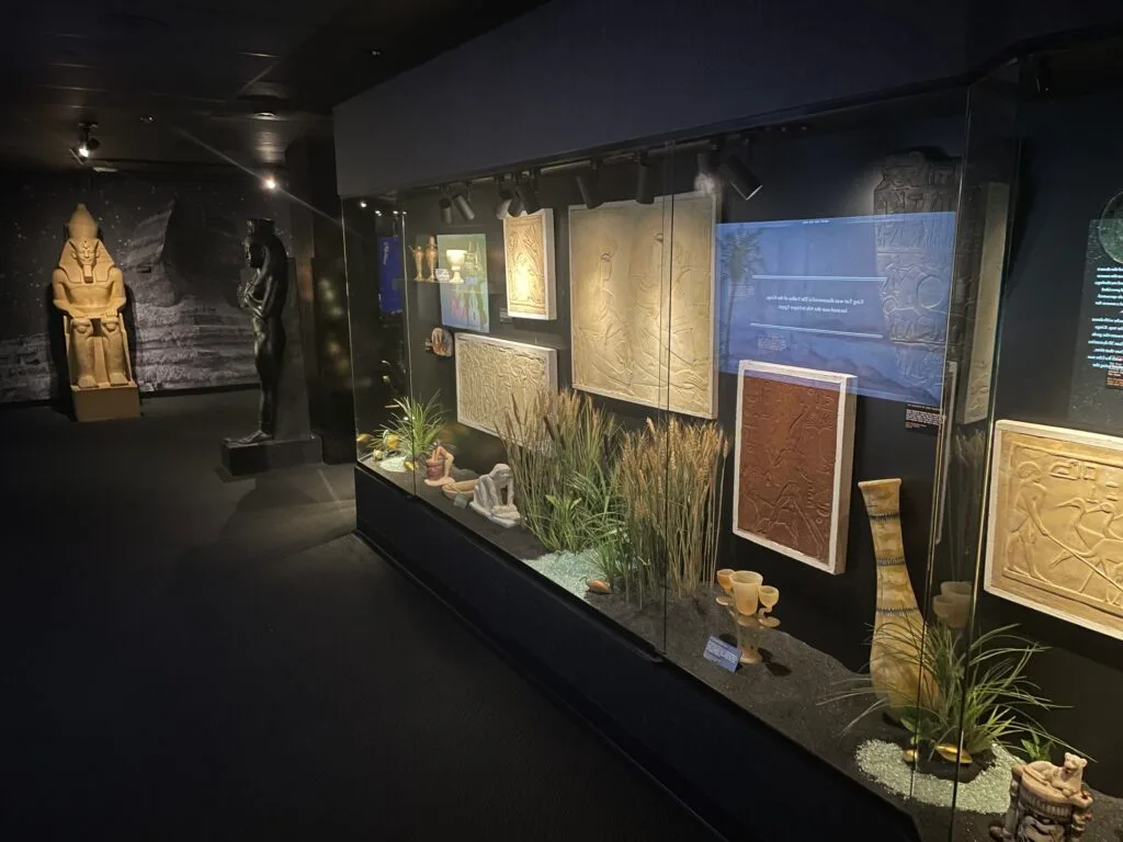 Items of cultural significance are housed behind a glass wall.