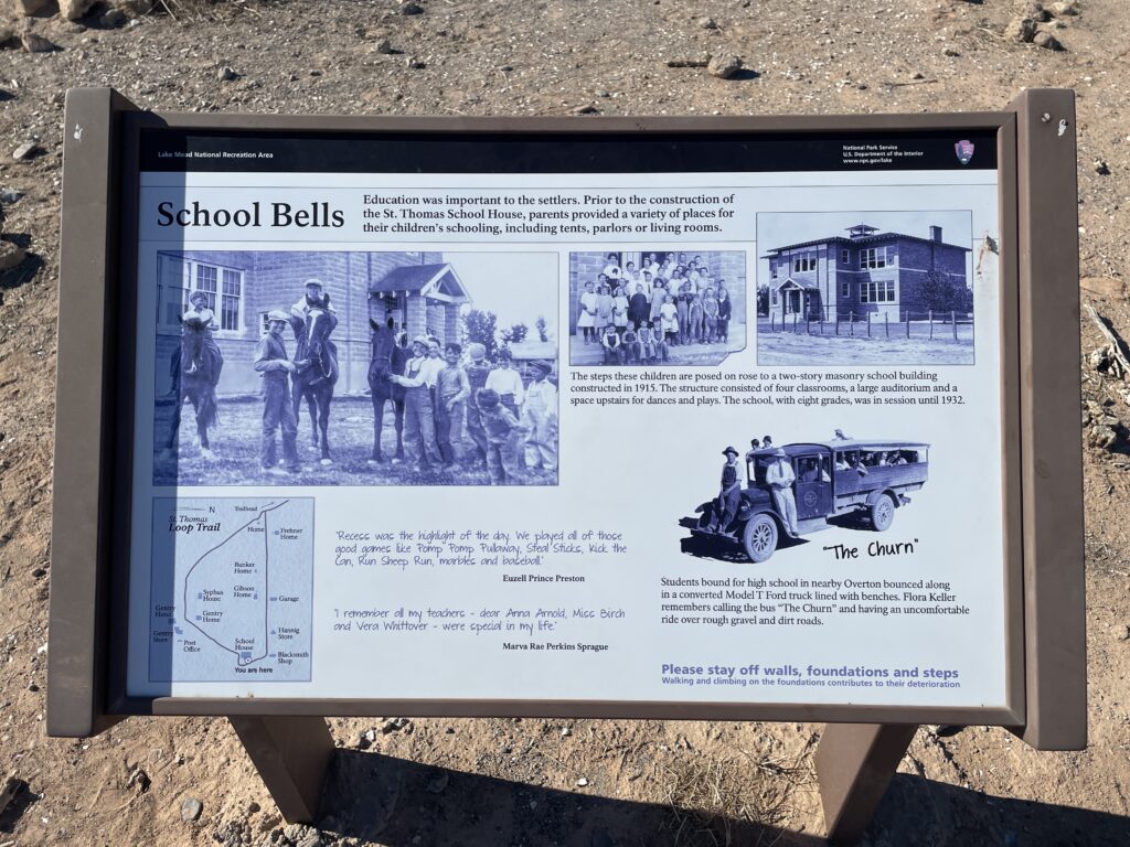 An information placard that shows the St. Thomas Schoolhouse in its prime and provides more information. 