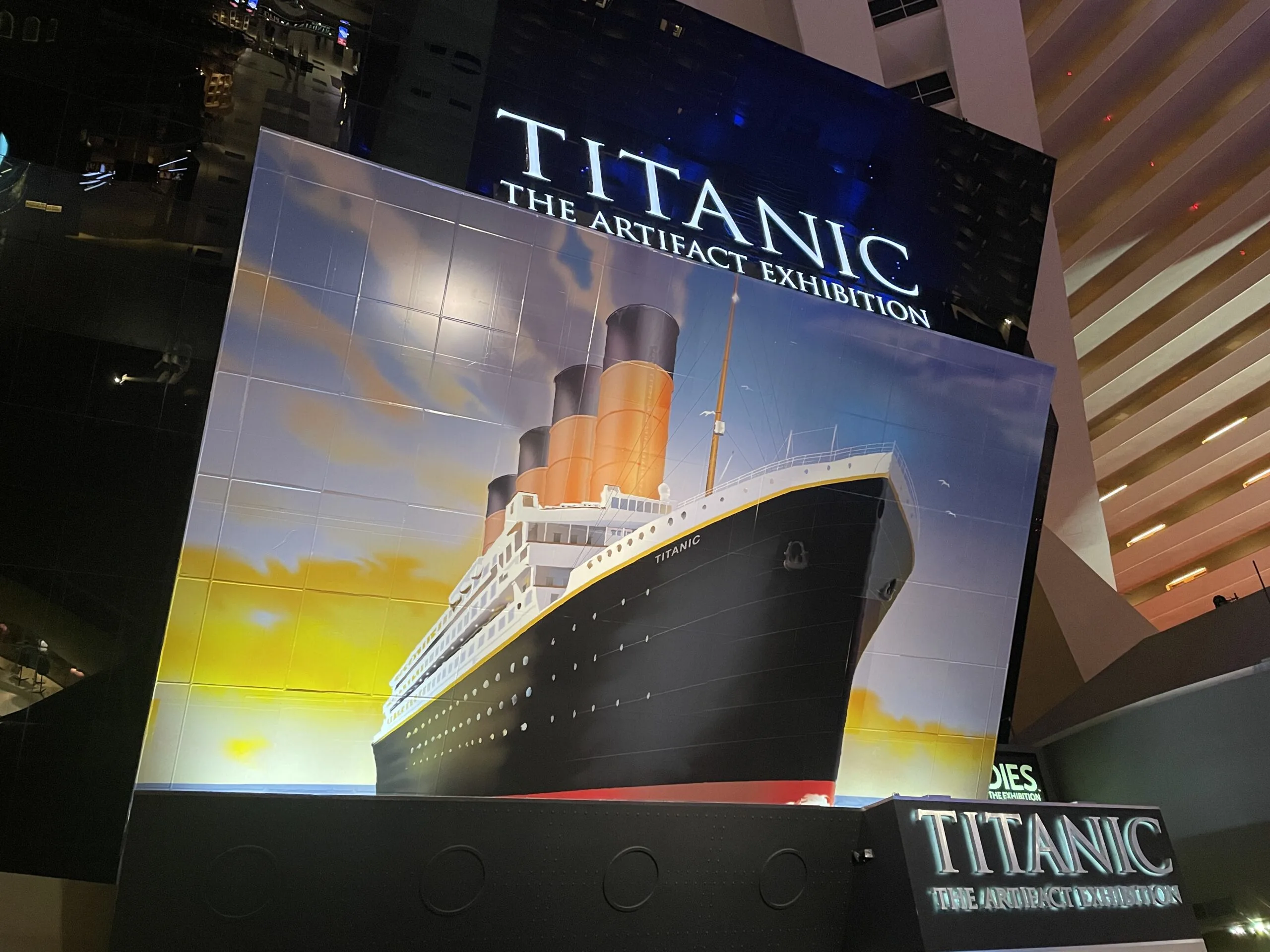 The marquee to Luxor's Titanic Exhibit, which depicts a large painting of the ship above the entrance.