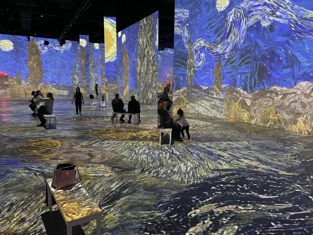 Paining of an evening sky on the walls of the Van Gogh Experience.