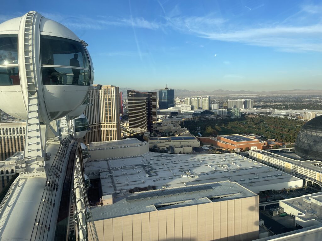 Another high roller pod is visible to the left, while north Strip hotels can be seen from the height of the High Roller to the right. 