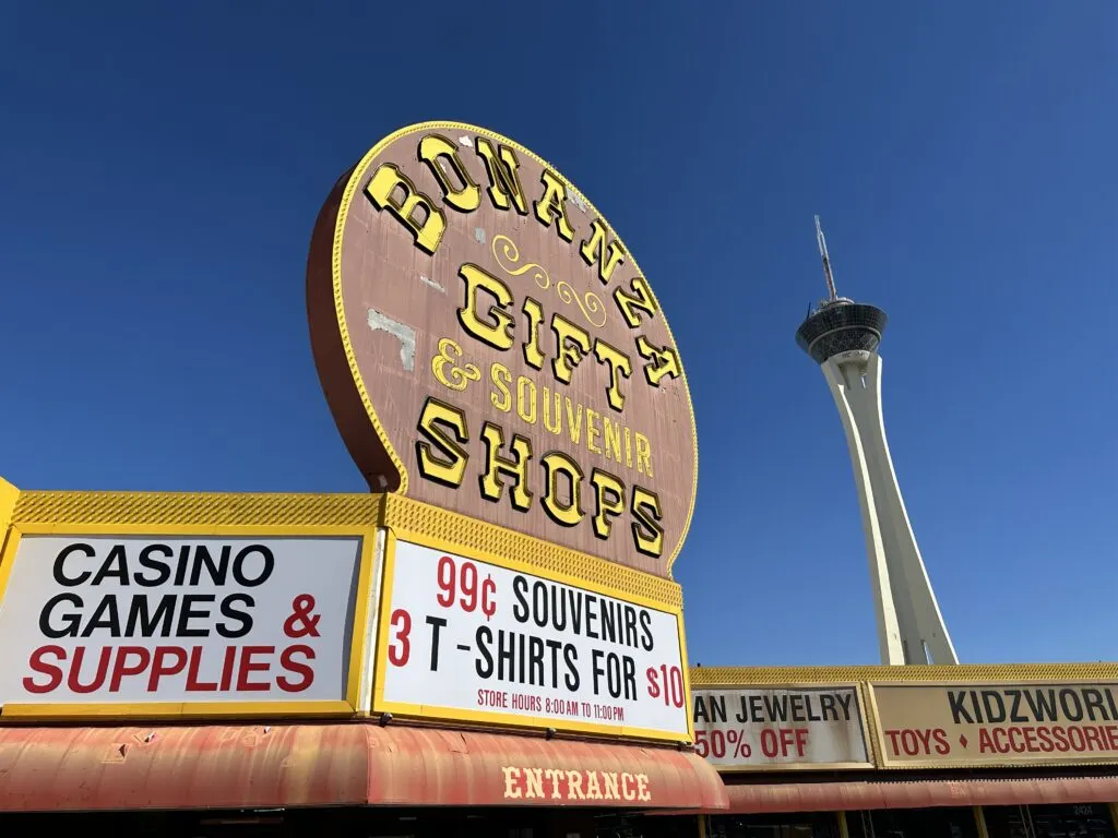 Bonanza's weathered exterior marquee with STRAT's SkyPod towering over head in the background.