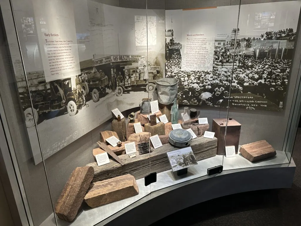 Artifacts from the Test Site's mining and ranching history behind glass. 