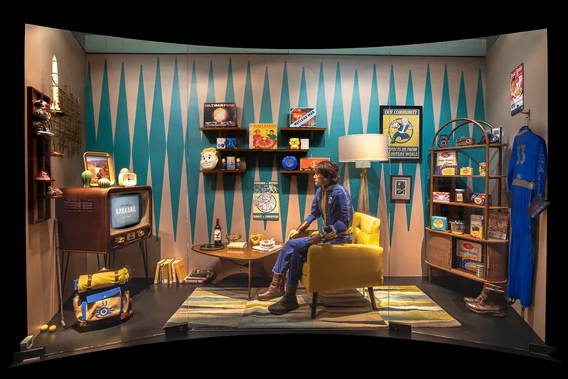 A set recreation of a character in Fallout sitting in their vault bedroom. 