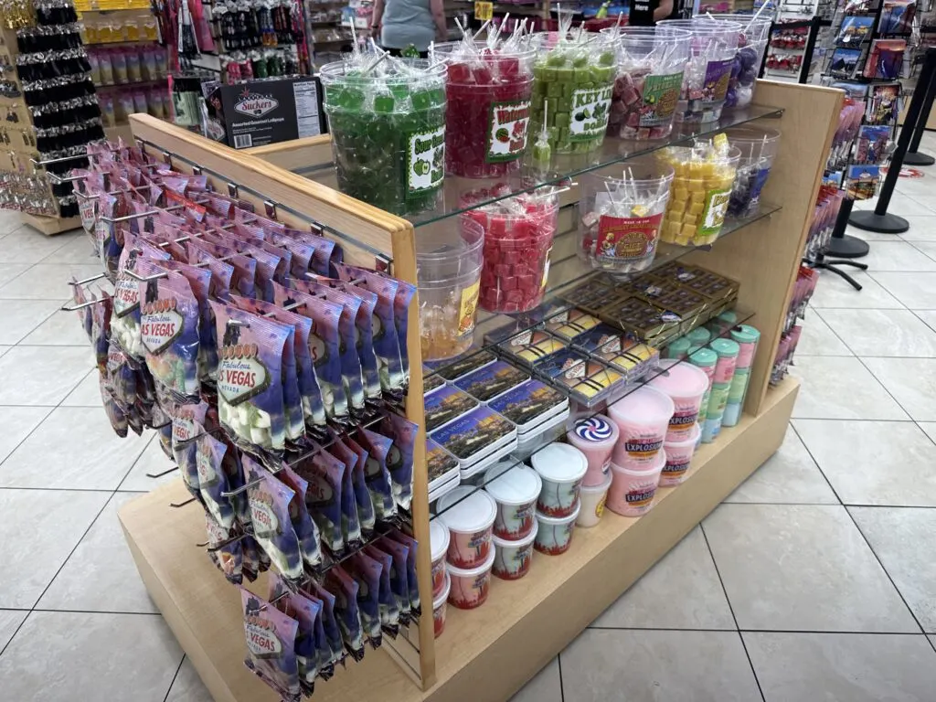 An assortment of gummy candies and suckers on display. 