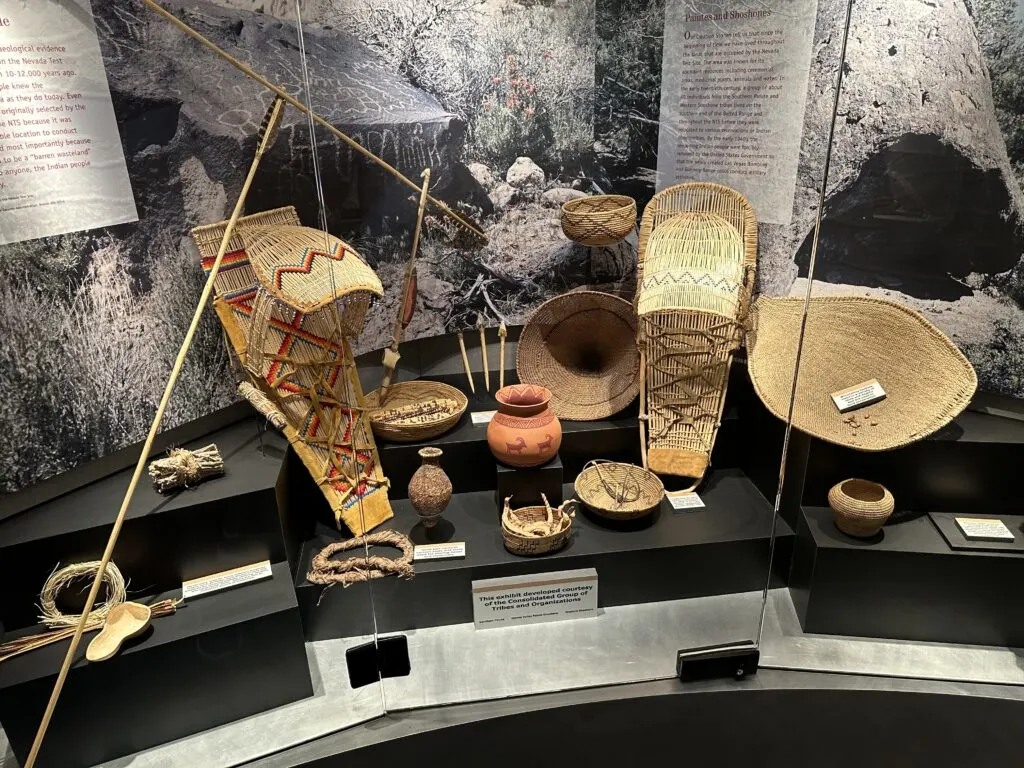 A case of re-created native American artifacts behind glass. 