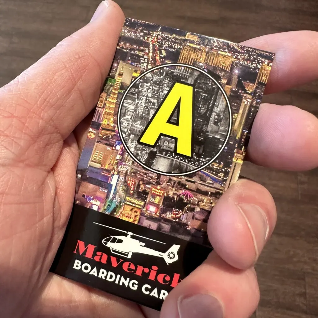 A boarding card with a large letter A on it. 