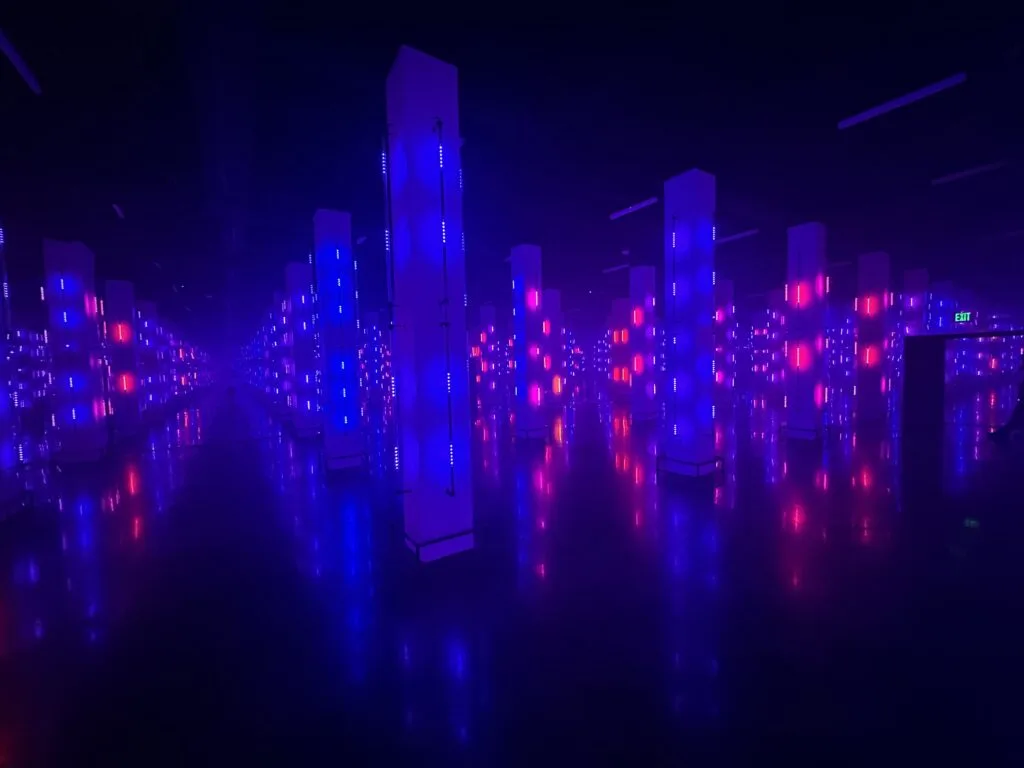 Pillars are illuminated in blue, but the back ones have started to turn pink. 