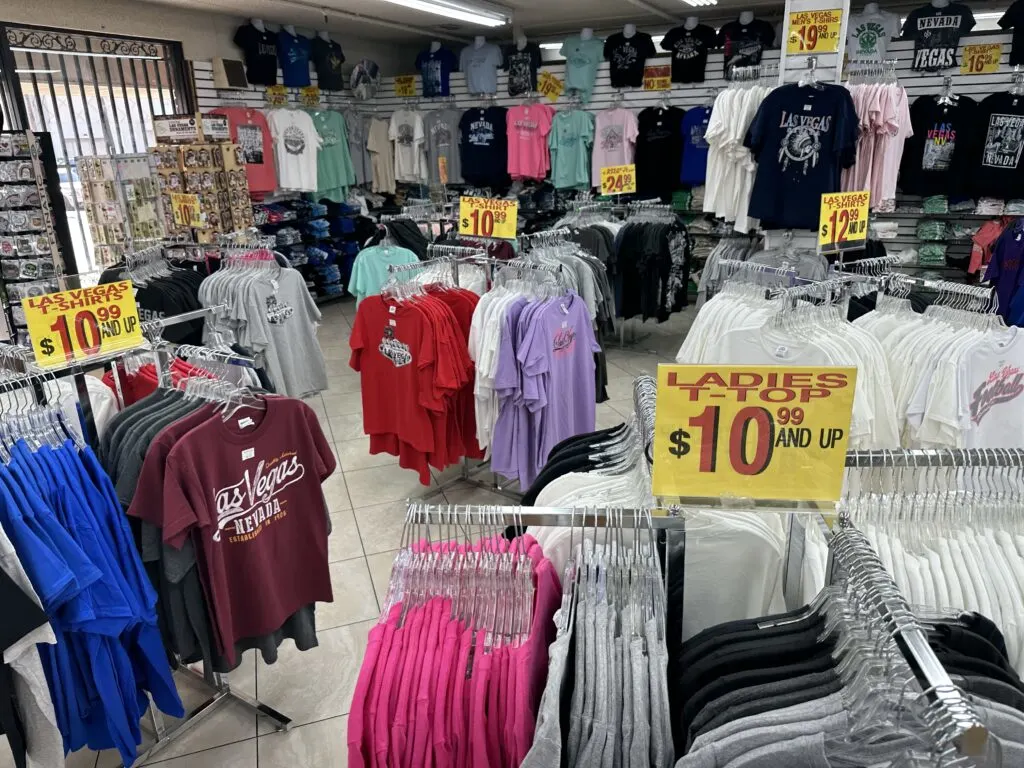 Rack after rack of shirts with various "Las Vegas" messaging. Many of which are priced at $10.99. 