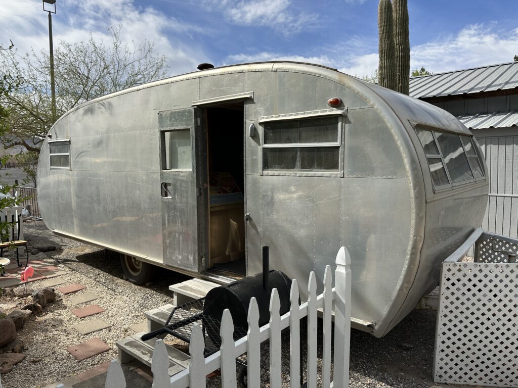Exterior of an early RV made of aluminum on Heritage Street. 
