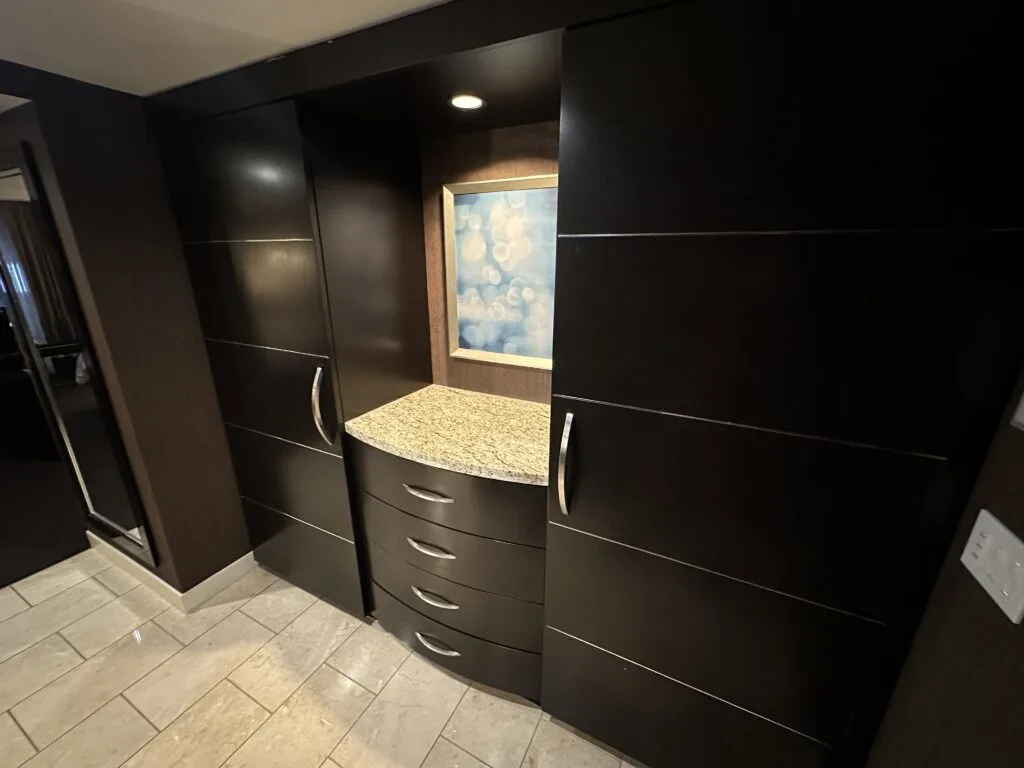 Two large closets and a stack of 4 drawers in the entryway to the Deluxe King room at Aria. 