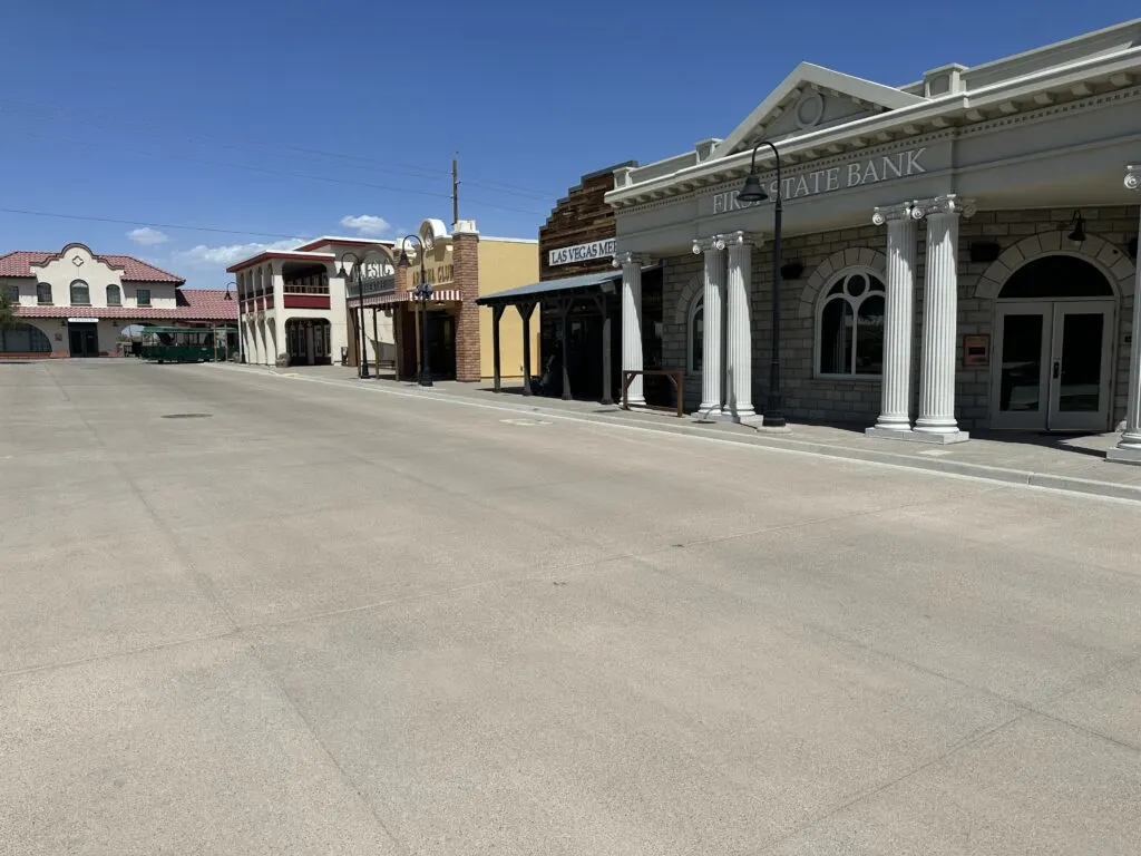 A street view of Boomtown 1905, where all the buildings on wone dside of the street are visible.