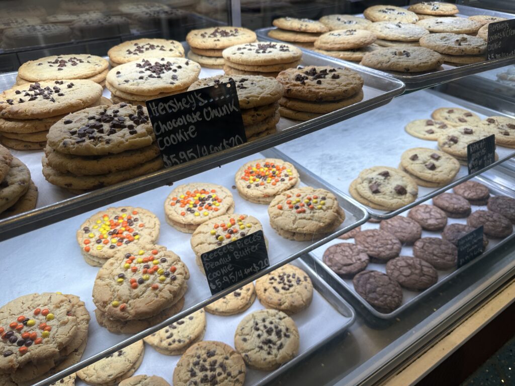 Assorted cookies displayed in the dessert case. 