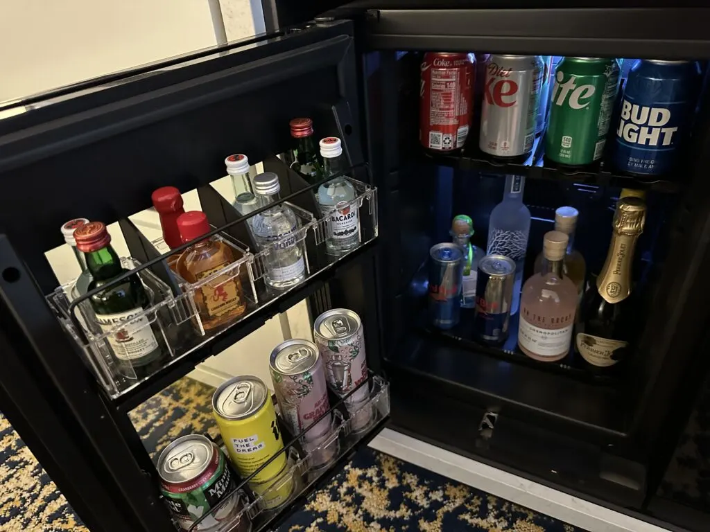 Drinks stocked in the fridge as part of the minibar. 