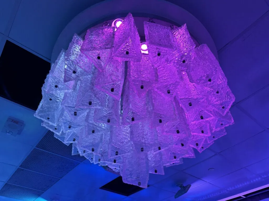 A chandelier made of ice on the ceiling in the icebar. 