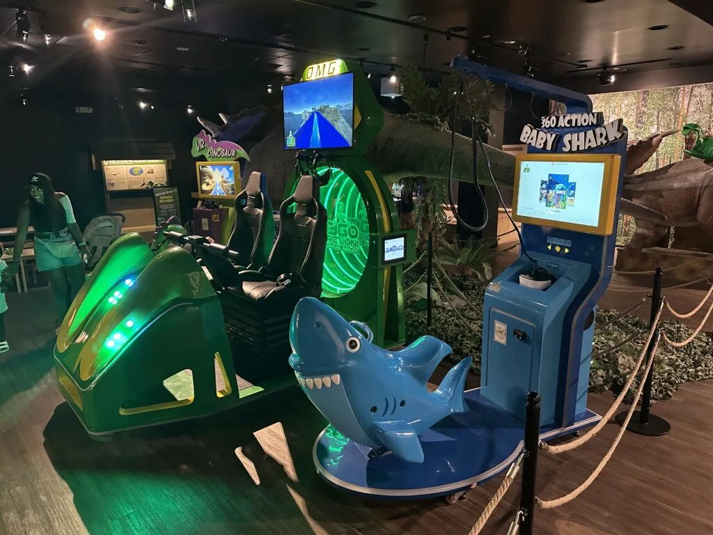 A line of 3 virtual reality rides at Dino Safari. 