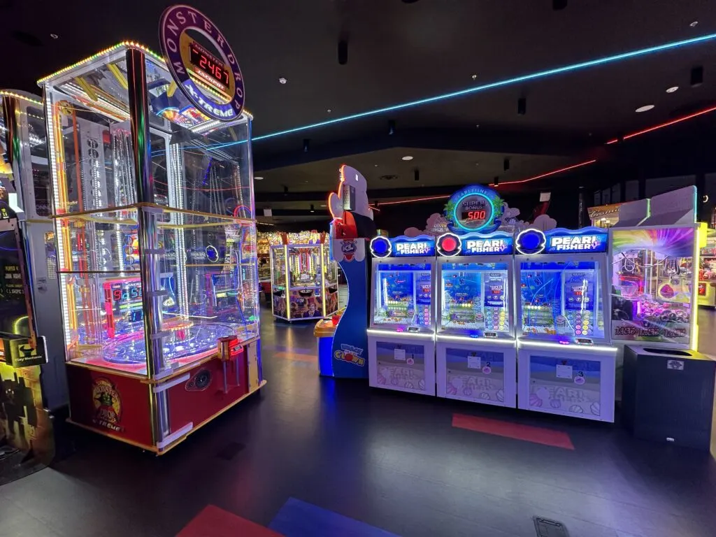 A wide angle shot of multiple arcade games. 