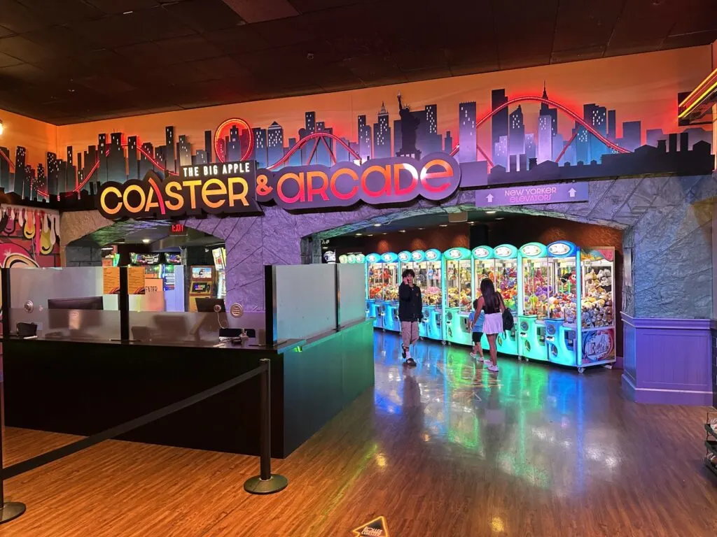 The entrance to NYNY's Arcade with a row of claw machines visible inside.
