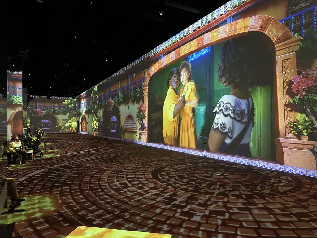 A scene from Encanto Plays on the Surround screen at Immersive Disney
