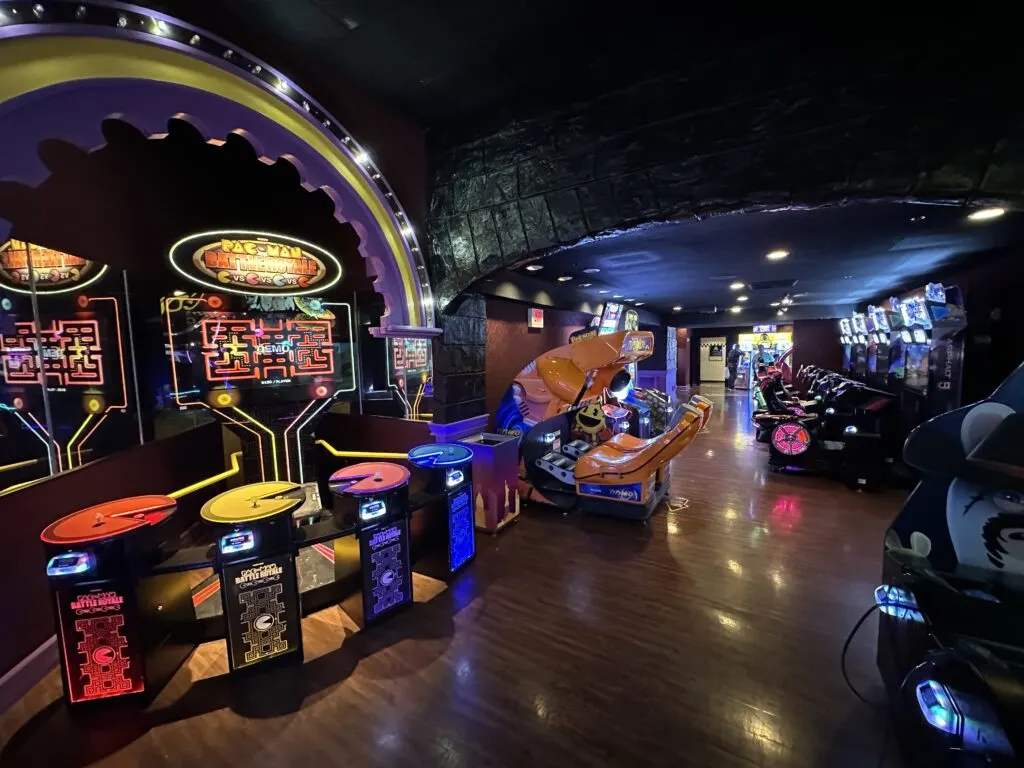 A wide angle shot of a large section of the arcade with numerous games scattered about. 