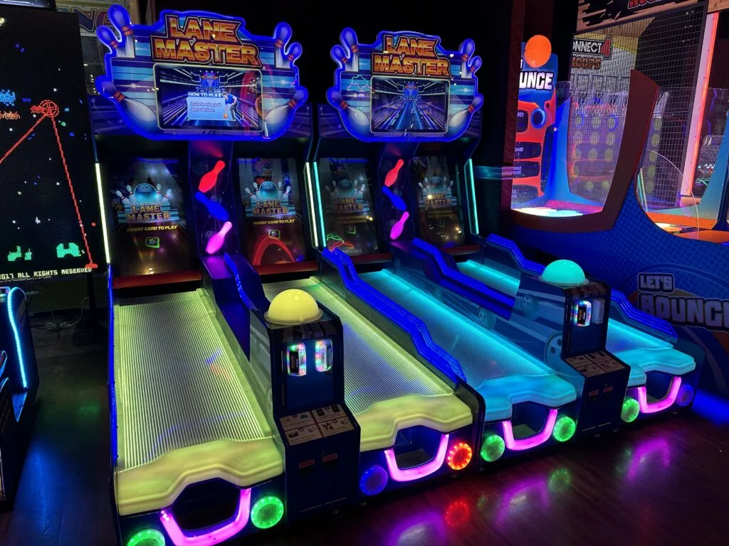 A row of Lane Master bowling arcade games. 