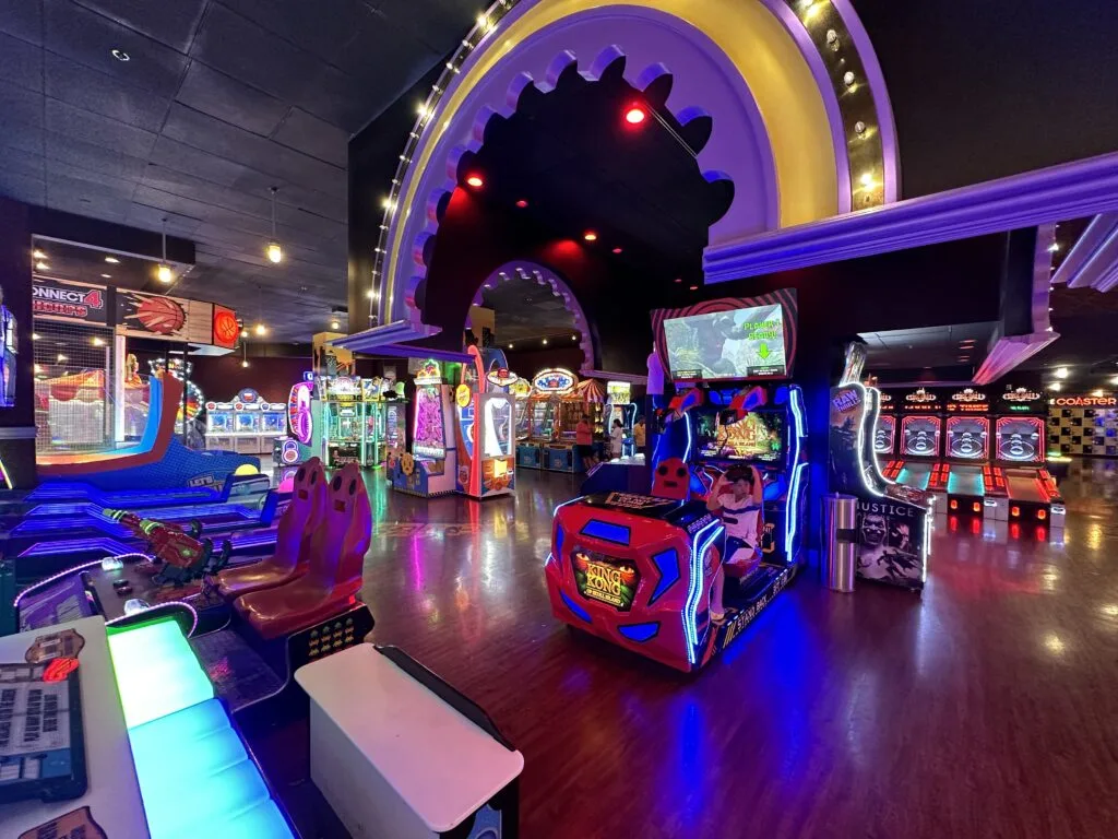 A wide angle photo of the arcade with a plethora of games scattered about.