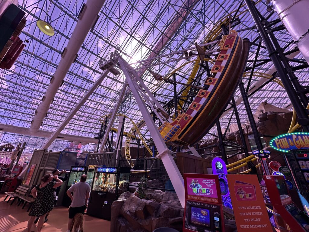 The pirate ship that is Sand Pirates is swung up and to the side in a nearly vertical position.