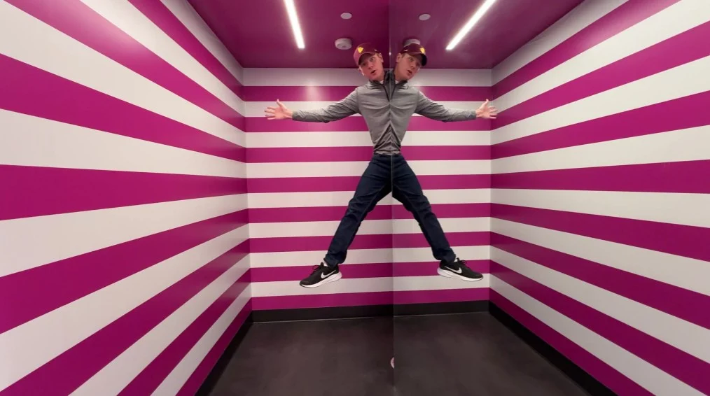 Me, looking very symmetridal as half of my body is hiding behind a mirror which is reflecting the part of my body that is visible. 