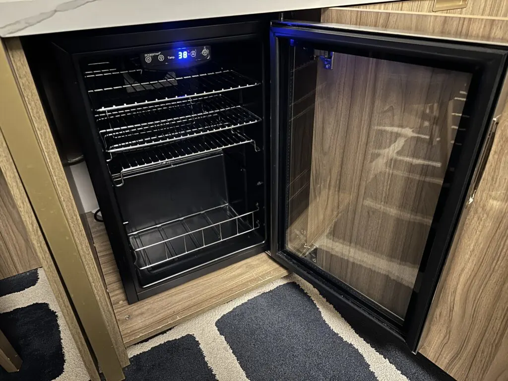 An empty black fridge set to 38 degrees F. 