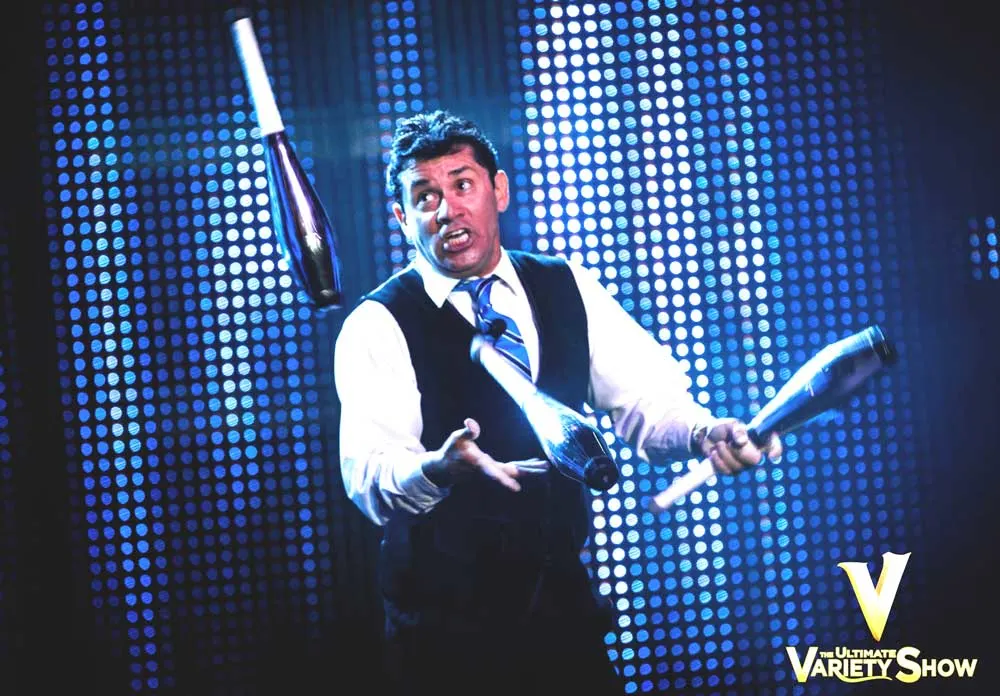 Wally Eastman, the host, juggling on stage.