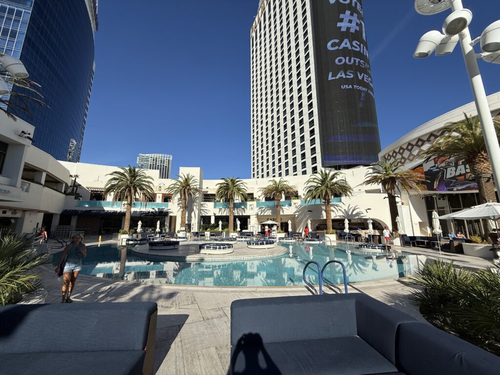 The pool, with palms 2 hotel towers in the background. 