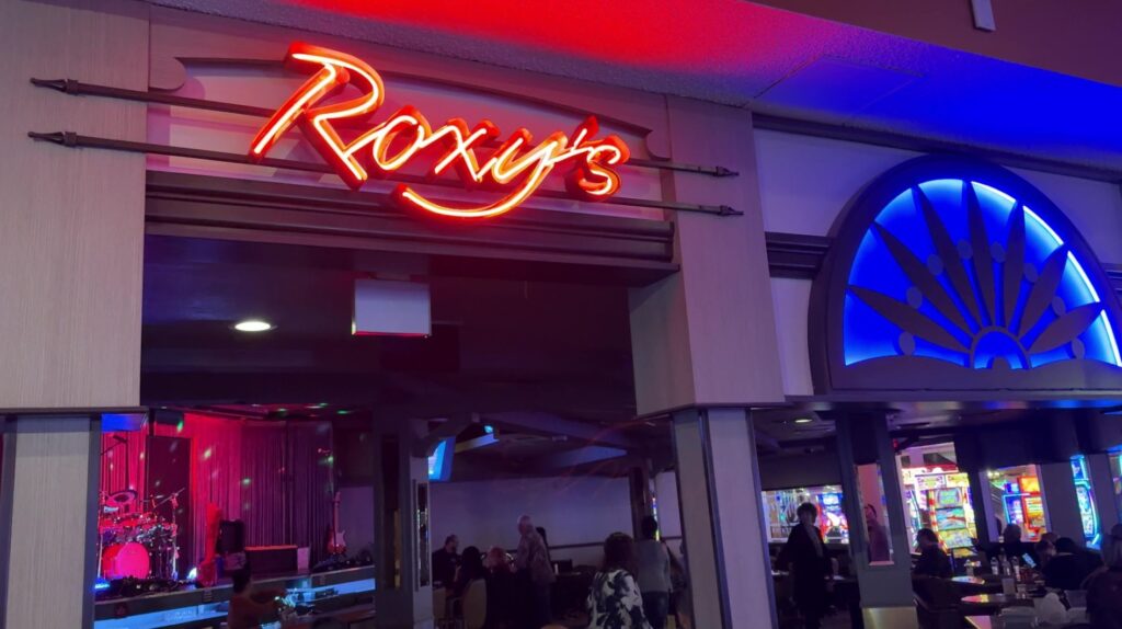 The neon sign above the entrance to Roxy's lounge. 