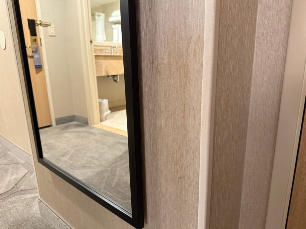 A faint splat stain on a wall in the room. 