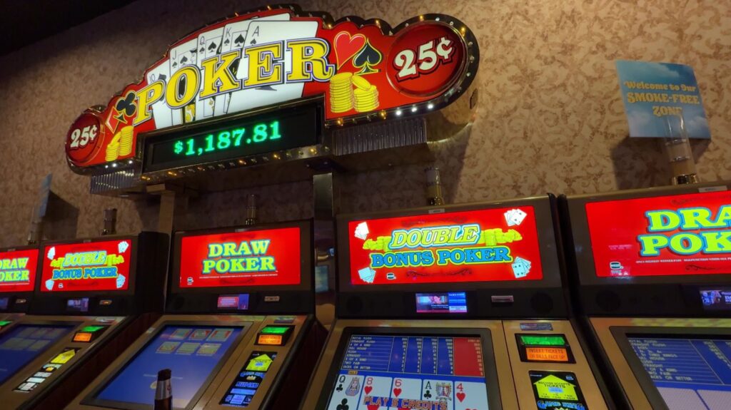 A progressive jackpot amount is posted above a row of VP machines. 