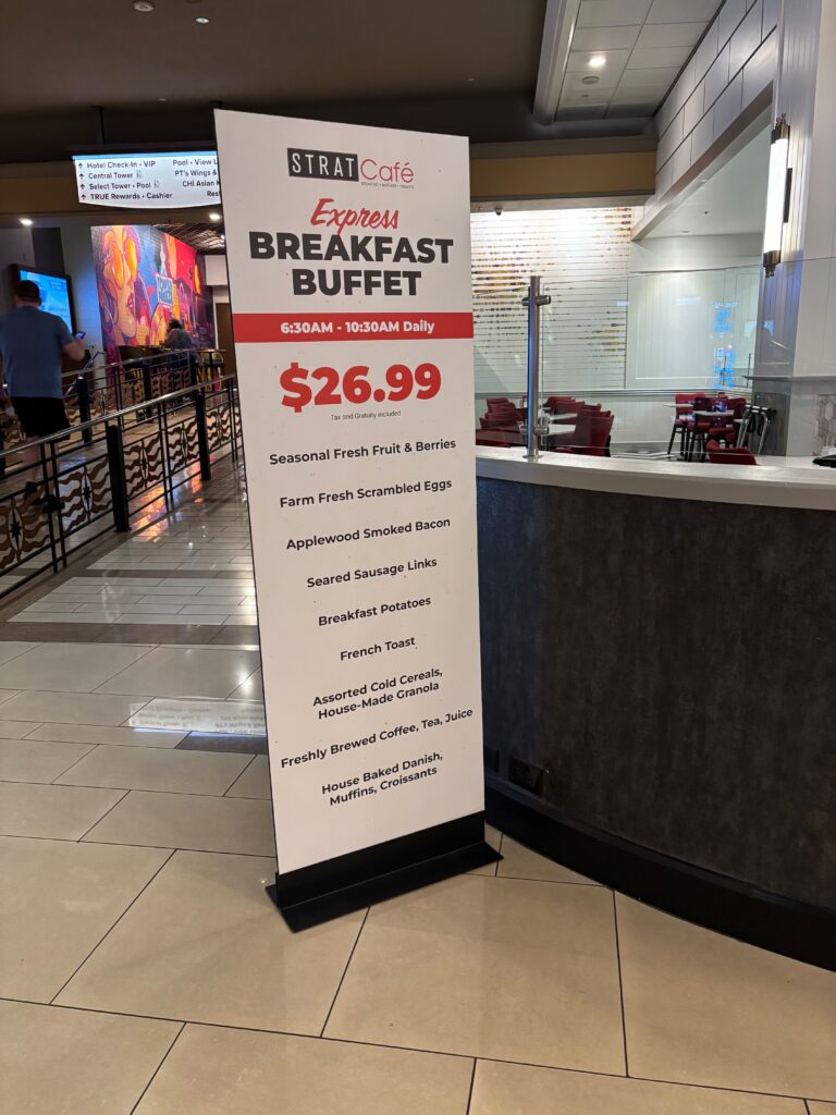 A sign advertising STRAT's Breakfast Buffet Deal.