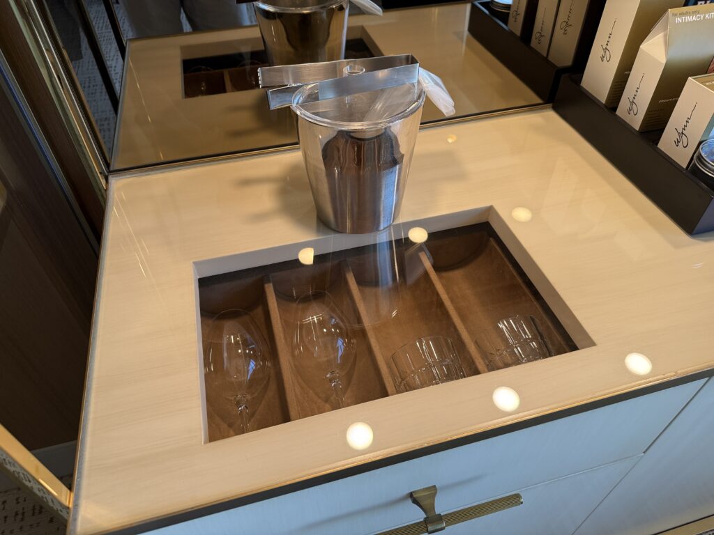 A window into a drawer with glassware displayed. 