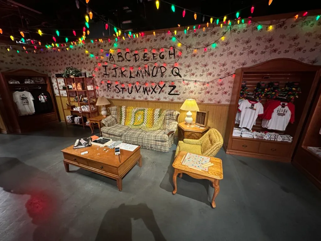 Byers House recreation with letters on the wall and Christmas lights hanging.