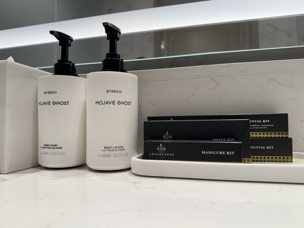 A tray of toiletries next to pump soaps.