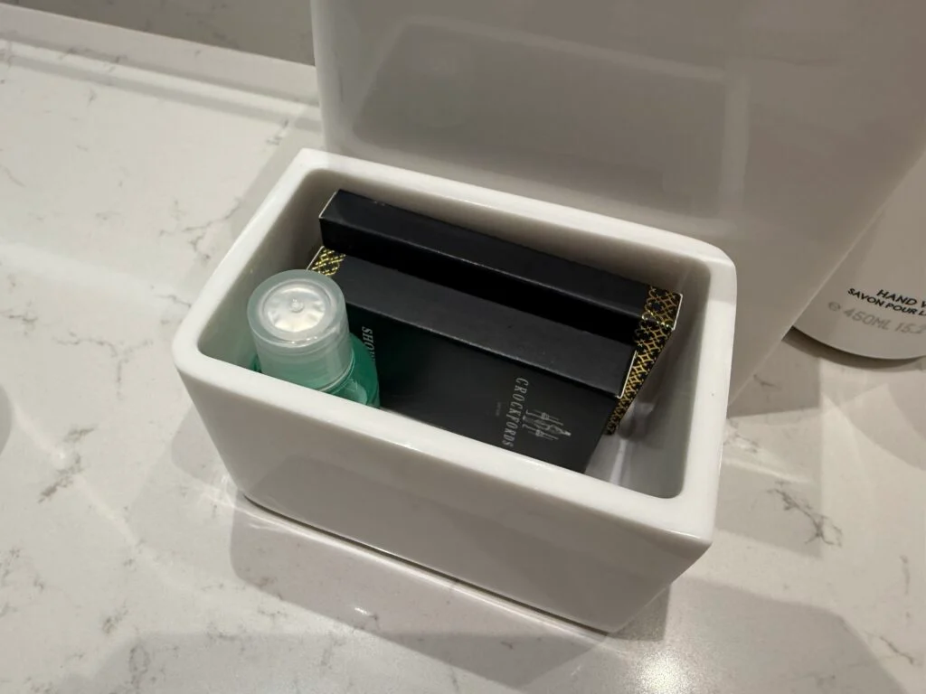 Another little basket of necessities like a shower cap and mouthwash. 