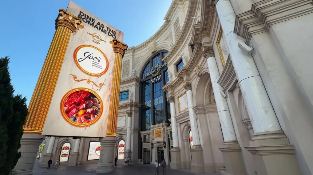 Exterior entrance to the Forum Shops at Caesars, which includes their massive LED marquee.