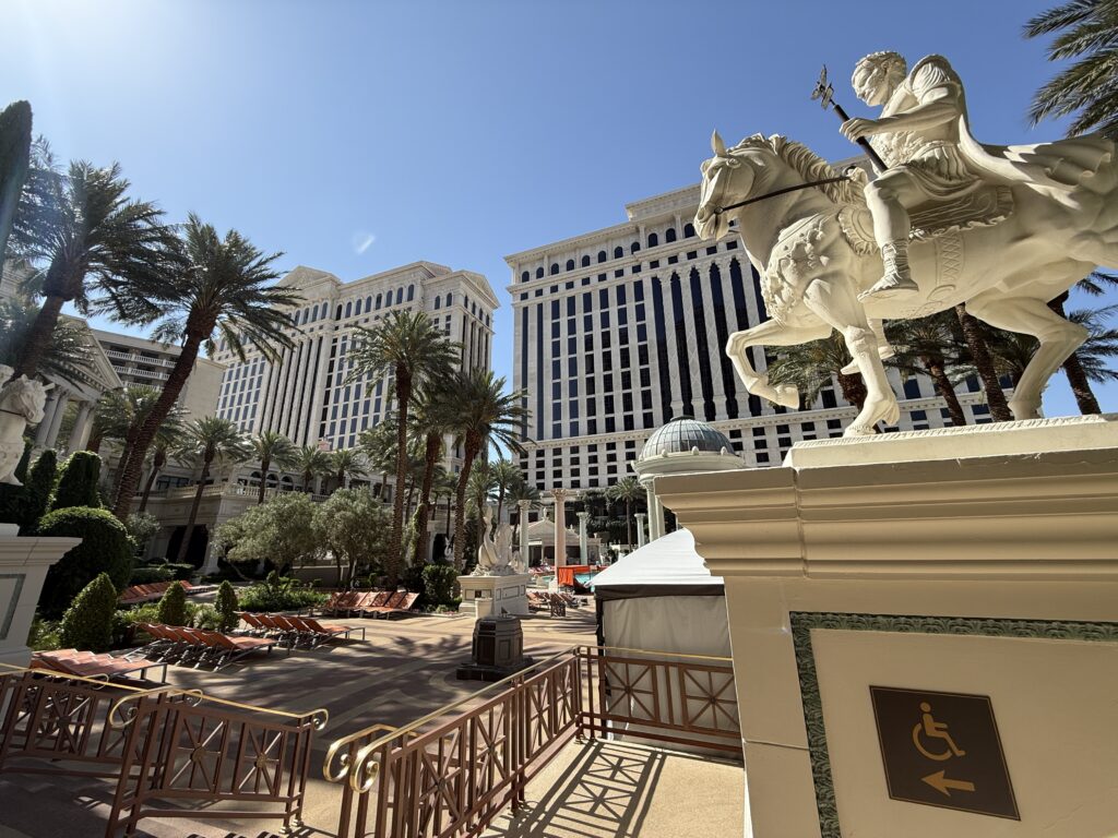 A statue on a horse at the entrance of the pool.